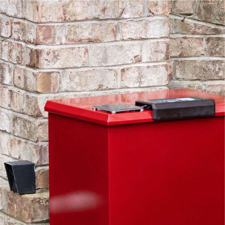 pocture of red loxxboxx sitting outside aside a brick home