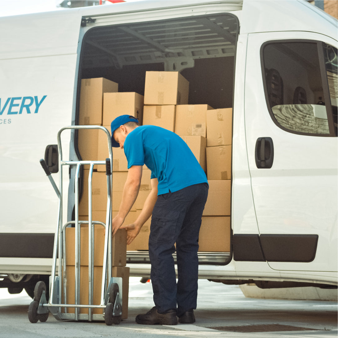 loxboxx app tracks and sends updates on package delivery. picture of a delivery man getting packages out of a delivery van