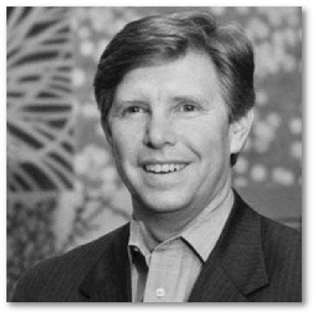 Black and white photo of a man with a patterned background